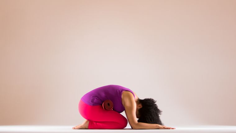 Rolled-up Yoga Mat in Practice