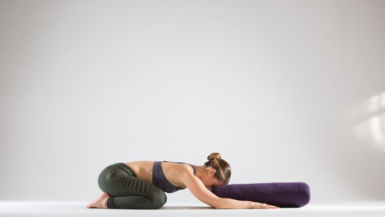childs-pose-inversion-prep-with-bolster