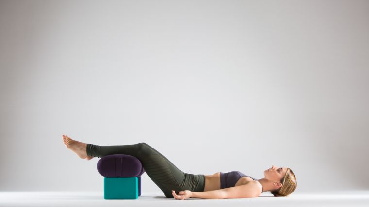 savasana-with-bolster-end-of-inversion-practice