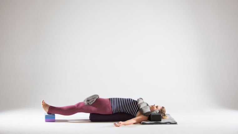 restorative-bridge-variation-with-yoga-sandbags