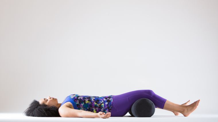 yoga for tight quads savasana with bolster