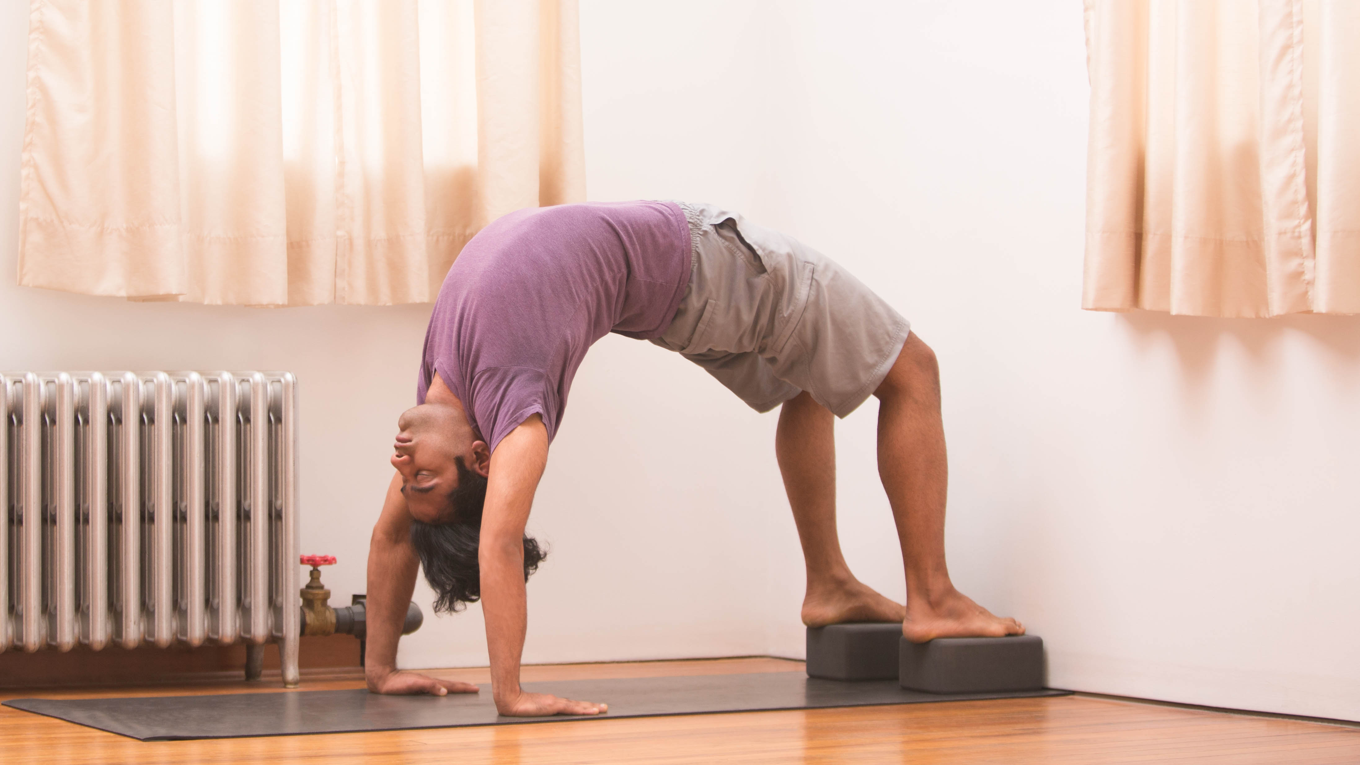 Use a Wall to Get More Out of Standing Backbend, Wheel, and Camel
